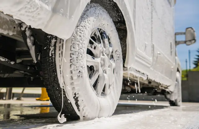 RV wheel and skirt under wash foam on the pad
